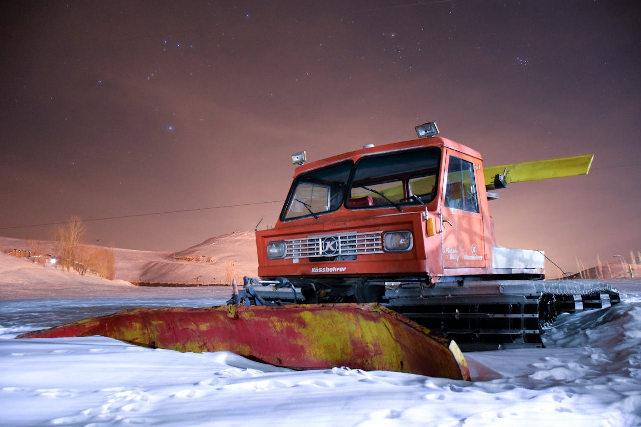 Nighttime snow plowing service by White Shovel keeping Laval roads accessible