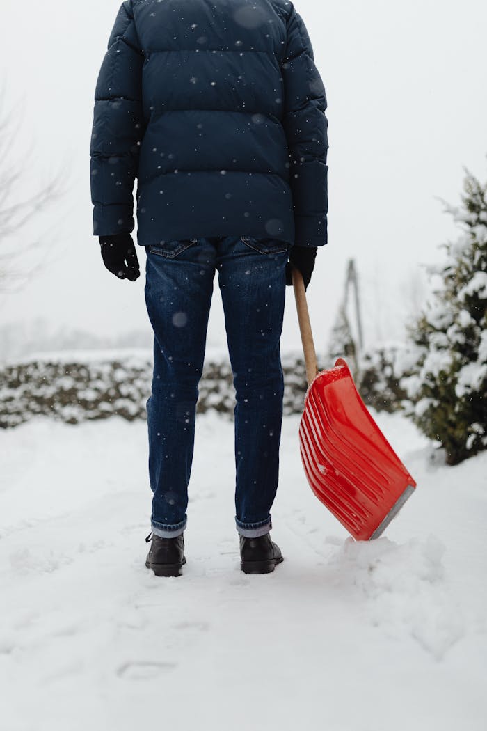 Experienced technician providing snow removal service in Laval with professional equipment